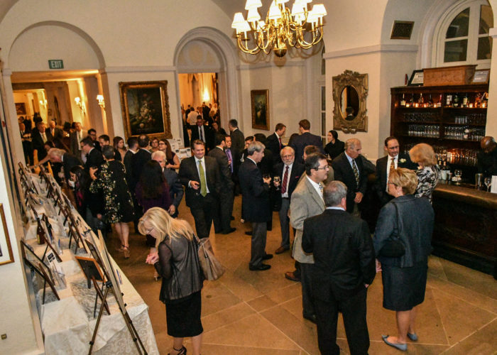 Guests network at the cocktail hour of the Gala